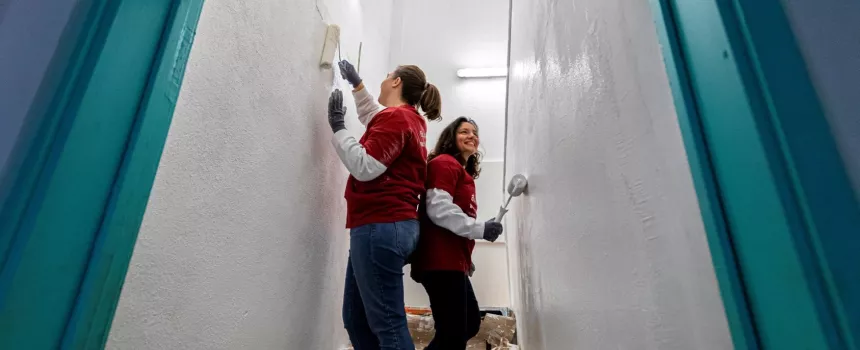 two girls remodeling a door
